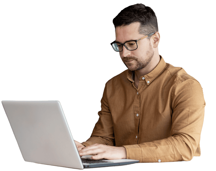 Man at laptop assessing talent